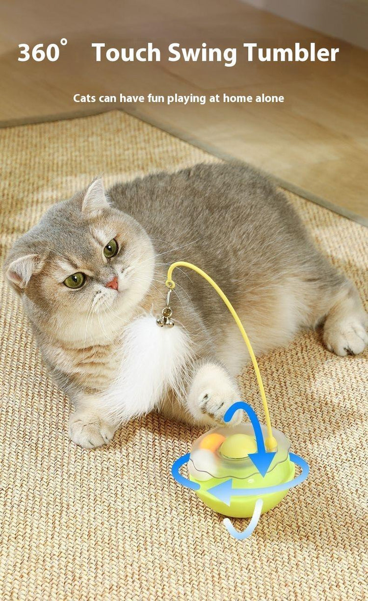 Gray cat playing with 360° touch swing tumbler toy on woven mat, perfect for solo play and cat accessories.