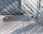Gray quilted pet car seat cover with red seatbelt clips for dog and cat travel safety