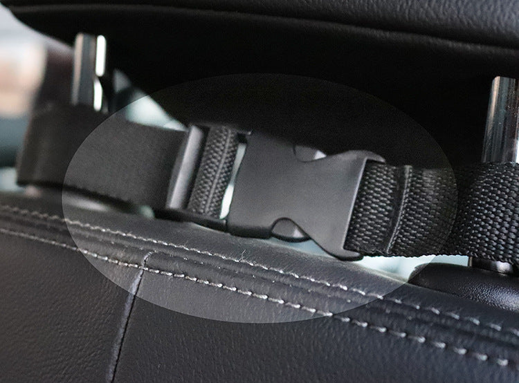 Black pet car seat belt with buckle, securing pet safety in vehicle