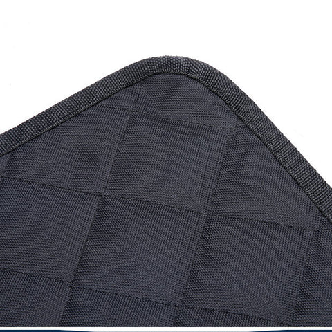Golden retriever on black quilted car seat cover with blue trim, perfect for pet travel and dog accessories.