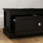 Black storage cabinet with open drawer on wooden floor