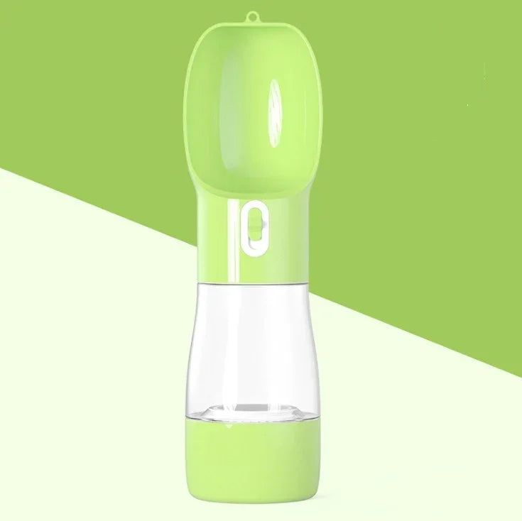 Portable pet water bottle with green lid and clear reservoir for dogs and cats on the go