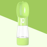 Portable pet water bottle with green lid and clear reservoir for dogs and cats on the go