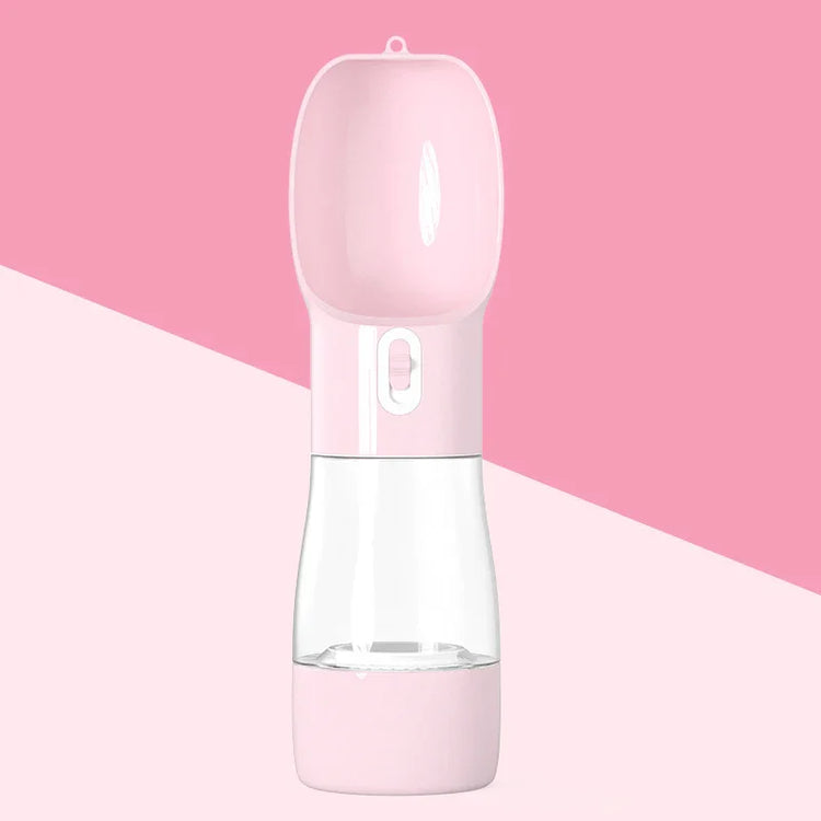 Pink portable pet water bottle for dogs and cats, ideal for travel and outdoor adventures