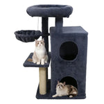 Cat tree with scratching post, condos, and perches for cats to play and rest