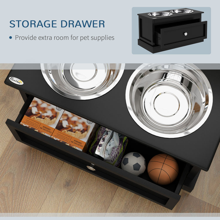 Black pet feeder with storage drawer holding toys and supplies, featuring stainless steel bowls.