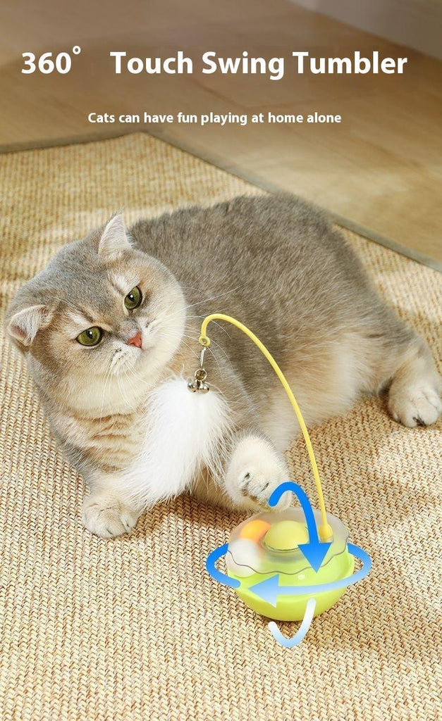 Gray cat playing with 360° touch swing tumbler toy on woven mat, perfect for solo play and cat accessories.