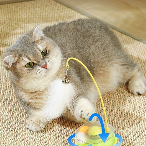 Fluorescent yellow cat toy with feather wand and ball dispenser for interactive play and exercise