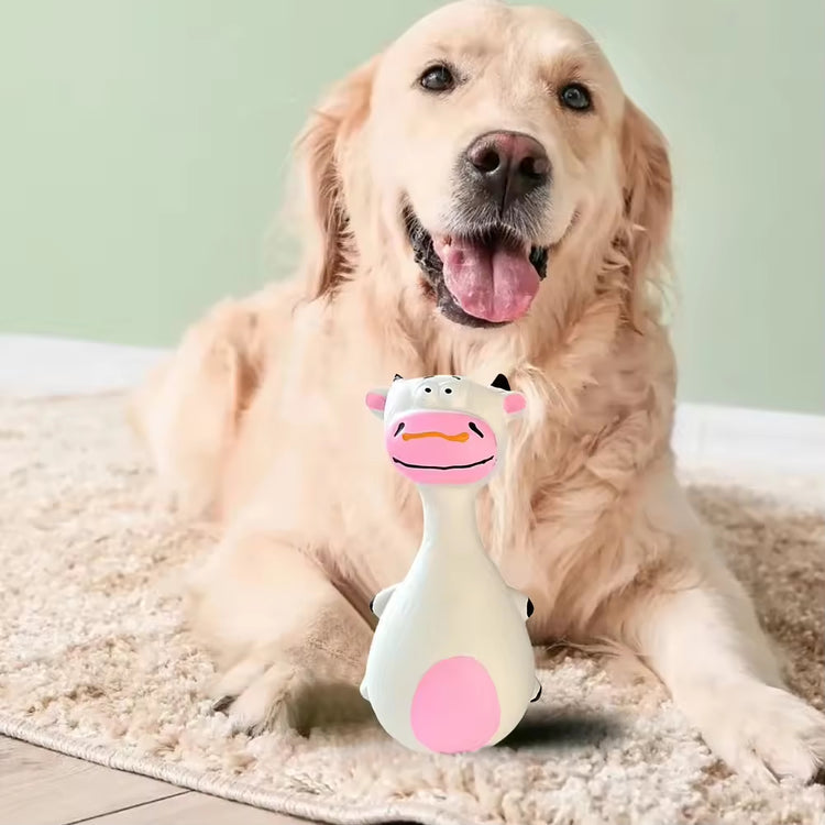 Happy golden retriever with cow-shaped dog toy on rug, perfect pet supplies for playful pups