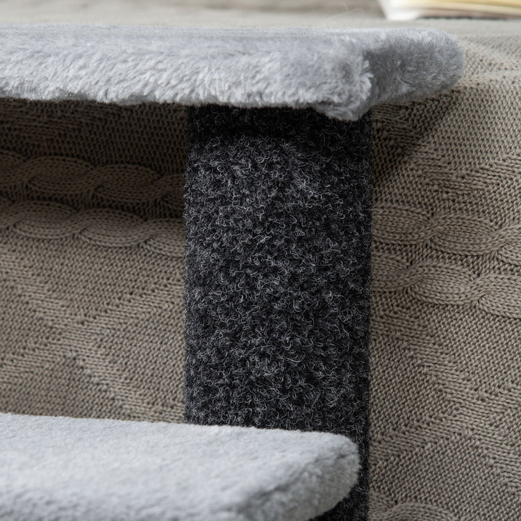 Soft gray cat tree with textured scratching post and cozy knitted base, perfect for feline play and rest.