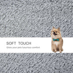 Fluffy Pomeranian dog wearing bow tie on soft gray pet bed, luxurious comfort for pets