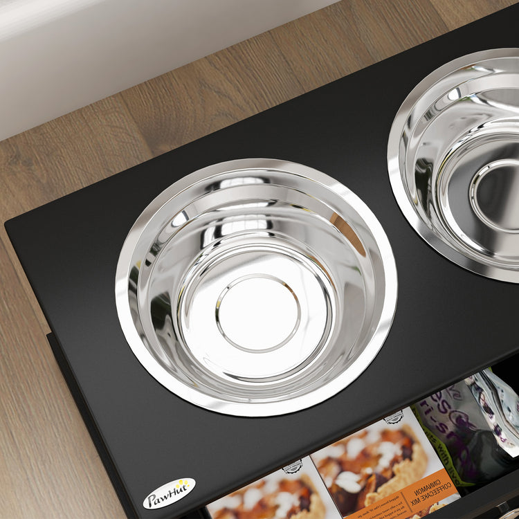 Stainless steel pet bowls on black feeding mat, ideal for dogs and cats. Durable, easy-clean pet supplies.