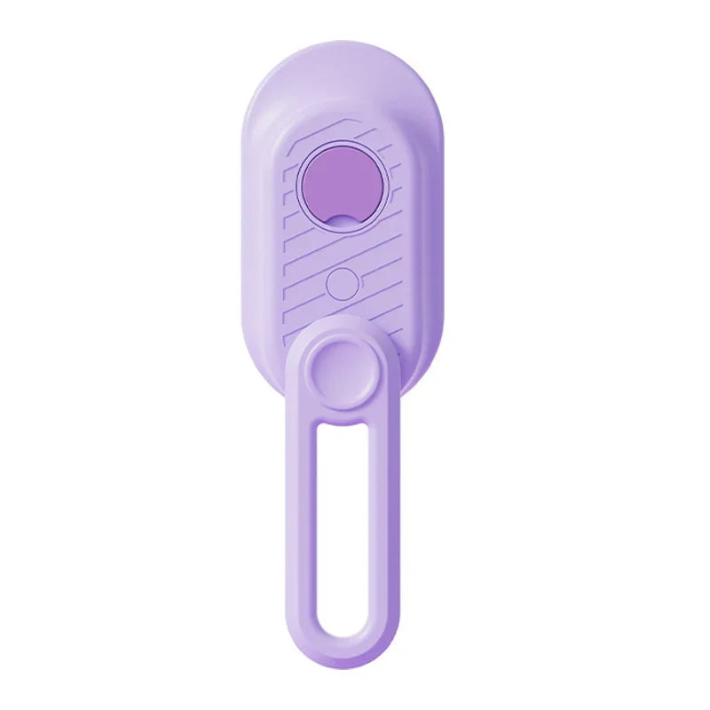 Purple pet grooming tool with ergonomic handle and textured grip for comfortable use