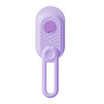 Purple pet grooming tool with ergonomic handle and textured grip for comfortable use